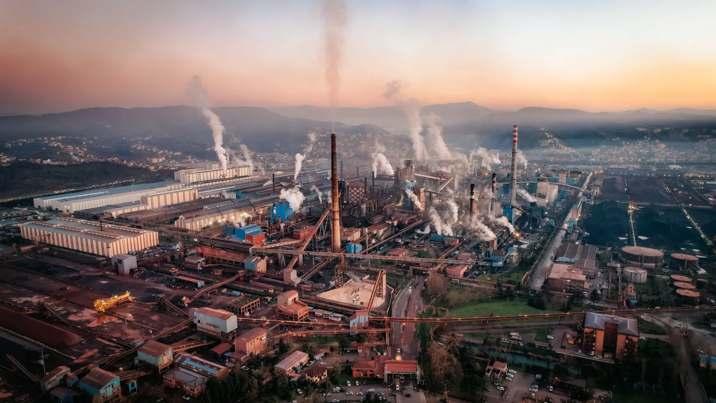 A large industrial works seen from the air at dusk