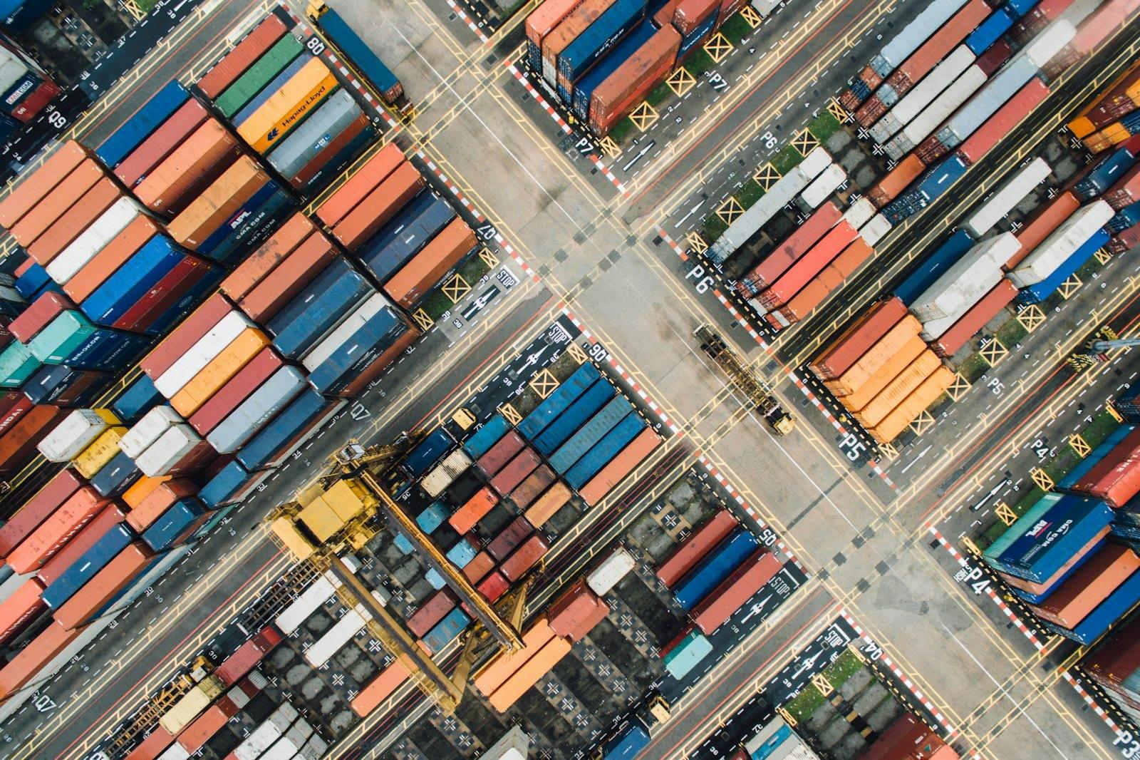 Shipping containers stacked in a port, seen from directly above